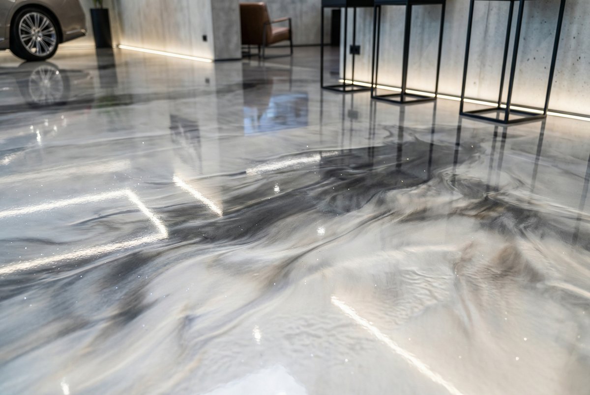 Metallic epoxy flooring with decorative swirl pattern in Palm Bay FL